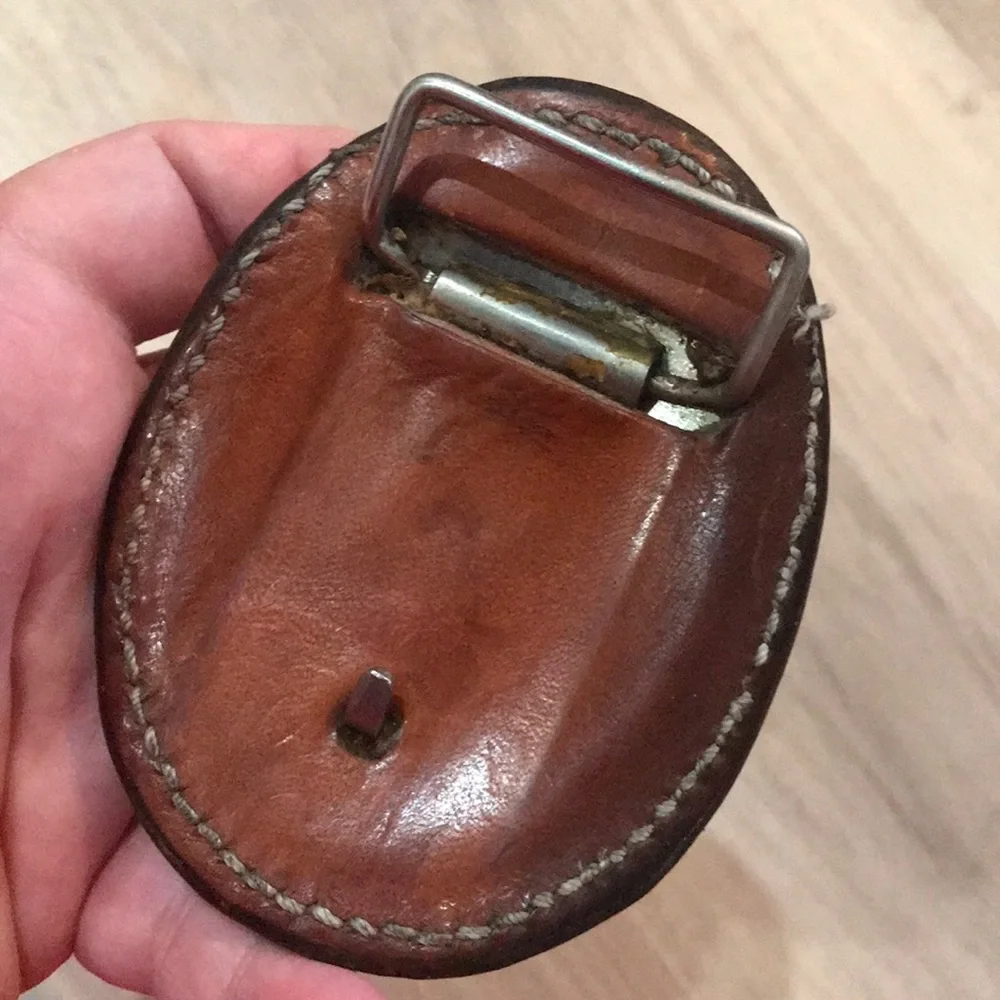 - Handcrafted leather seat belt buckle in brown